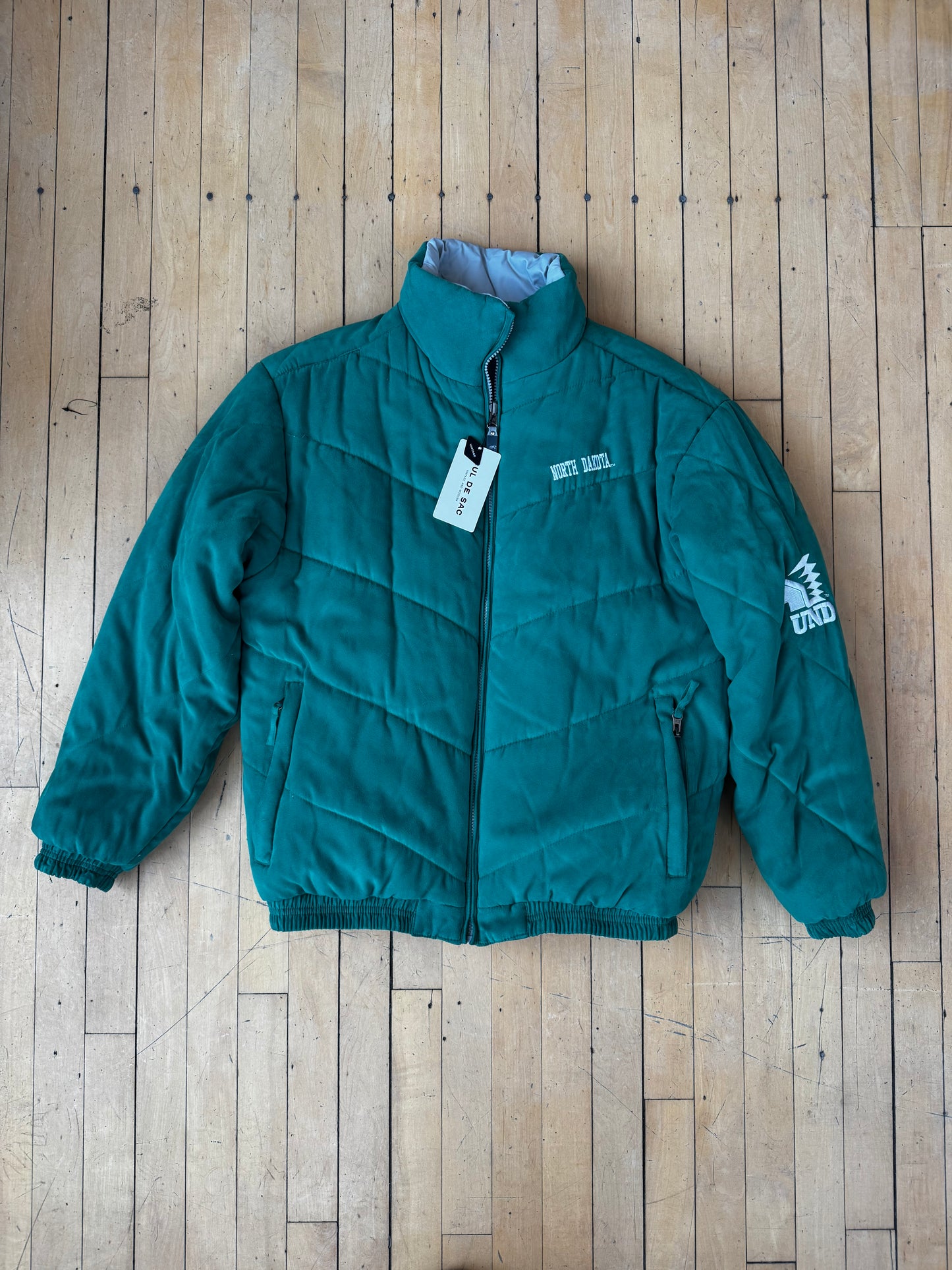 VINTAGE REVERSIBLE FIGHTING SIOUX PUFFER JACKET (M)